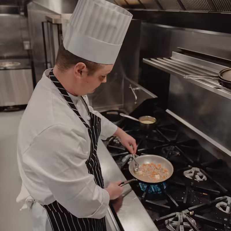 Resort kitchen team member cooking